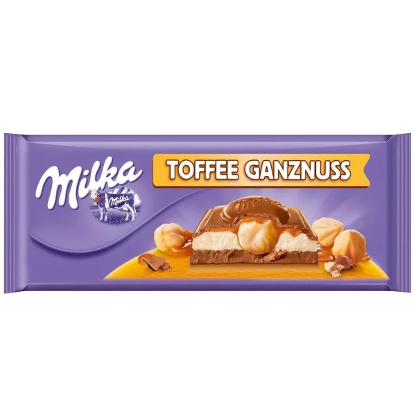 Шоколад молочний з Карамеллю Milka MMMAX Ganznuss Toffee Мілка цільні лісові горіхи та Карамель Тоффі Біг формат 300г - 1